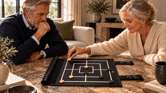Two players enjoying a game of Nine Men's Morris on a MELIA leather board