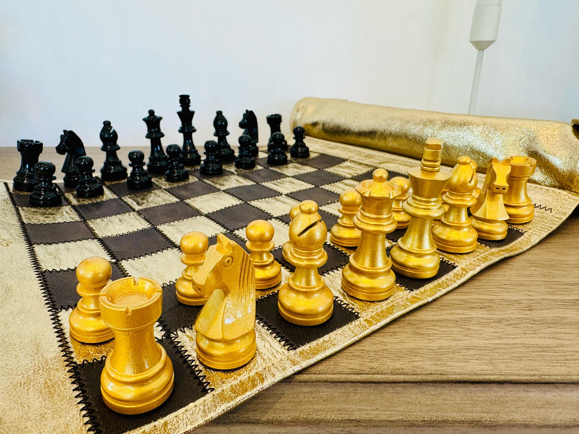 Close-up of black and gold magnetic chess pieces