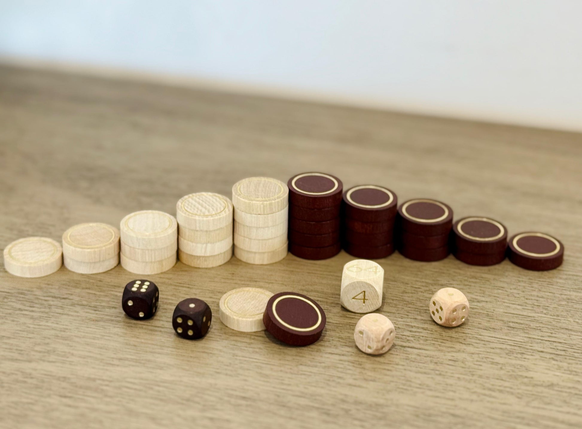 Wooden backgammon checkers dice and doubling cube from the roll-up set