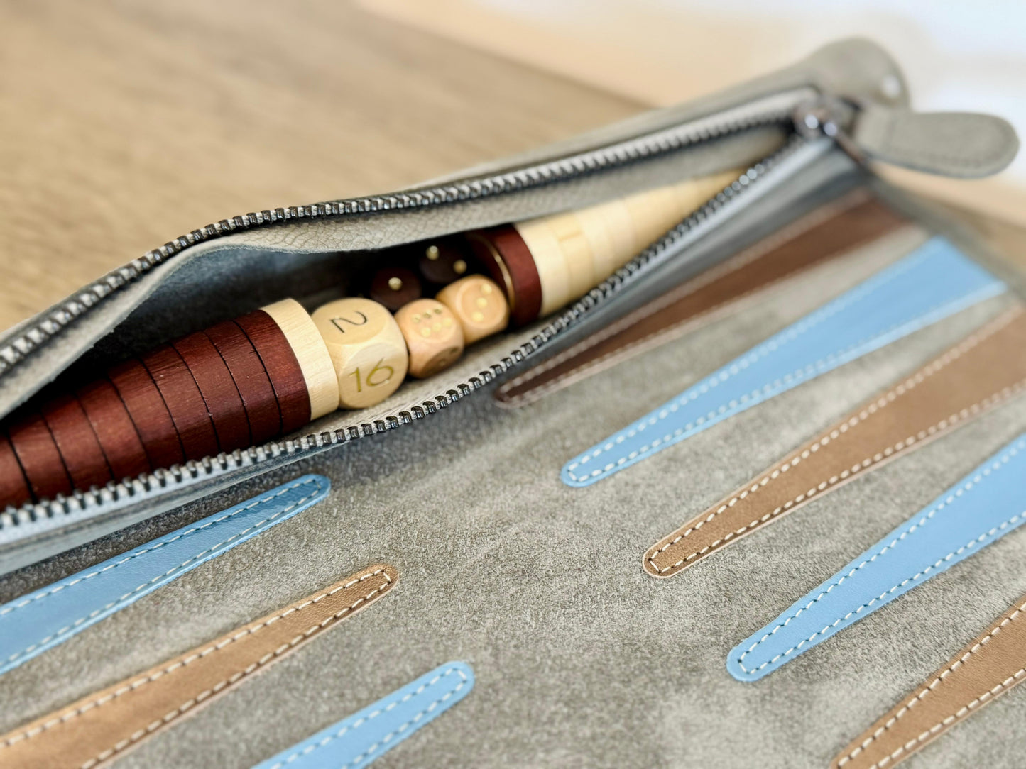 Integrated leather storage roll with backgammon checkers and dice