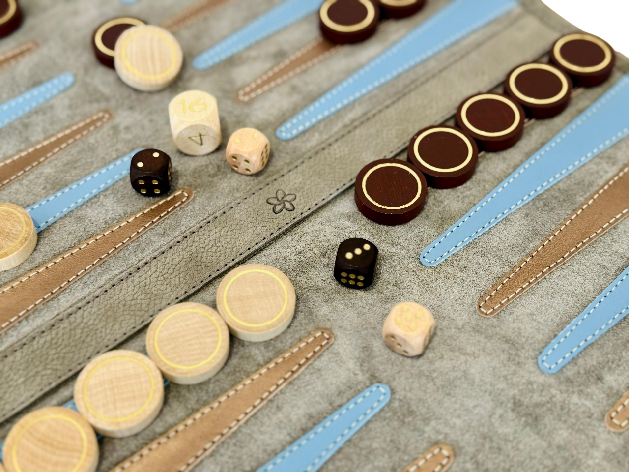 Champagne leather backgammon board with blue and brown stitched points