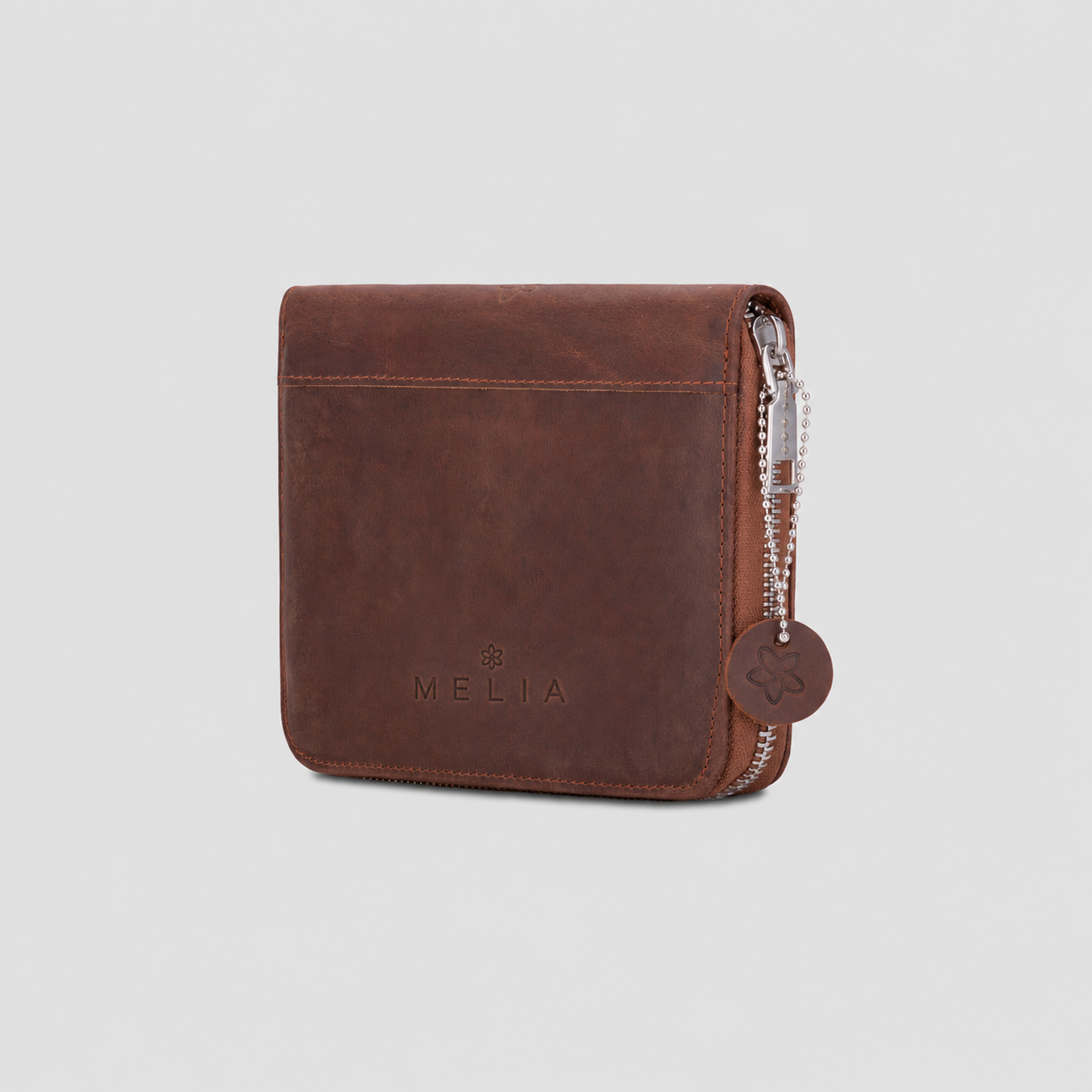 Classic Brown leather playing card set with cards and accessories arranged for travel