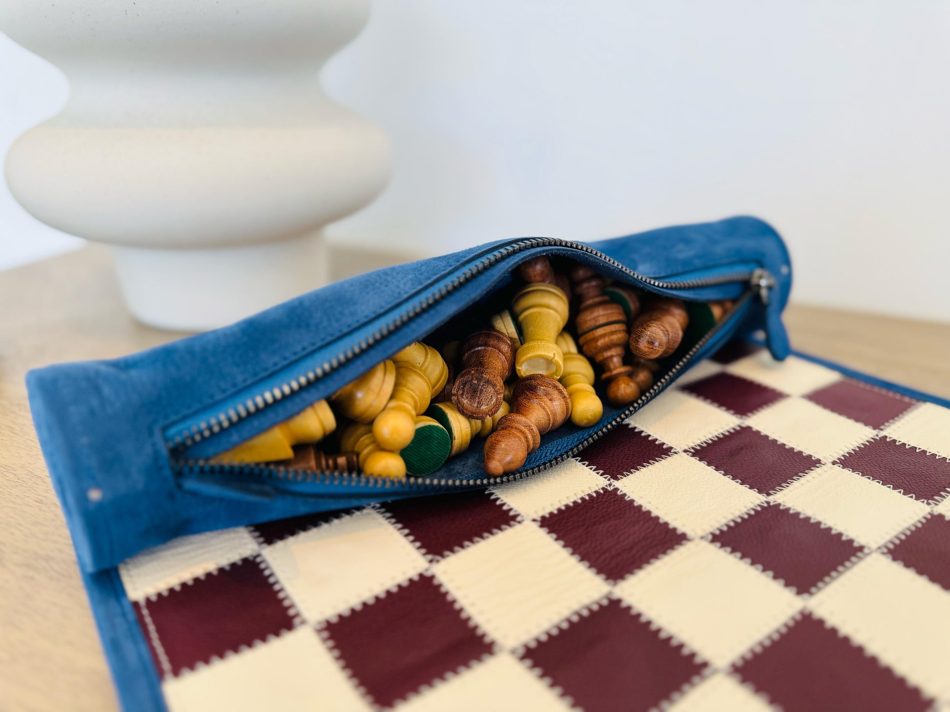 Premium leather storage compartment with magnetic chess pieces