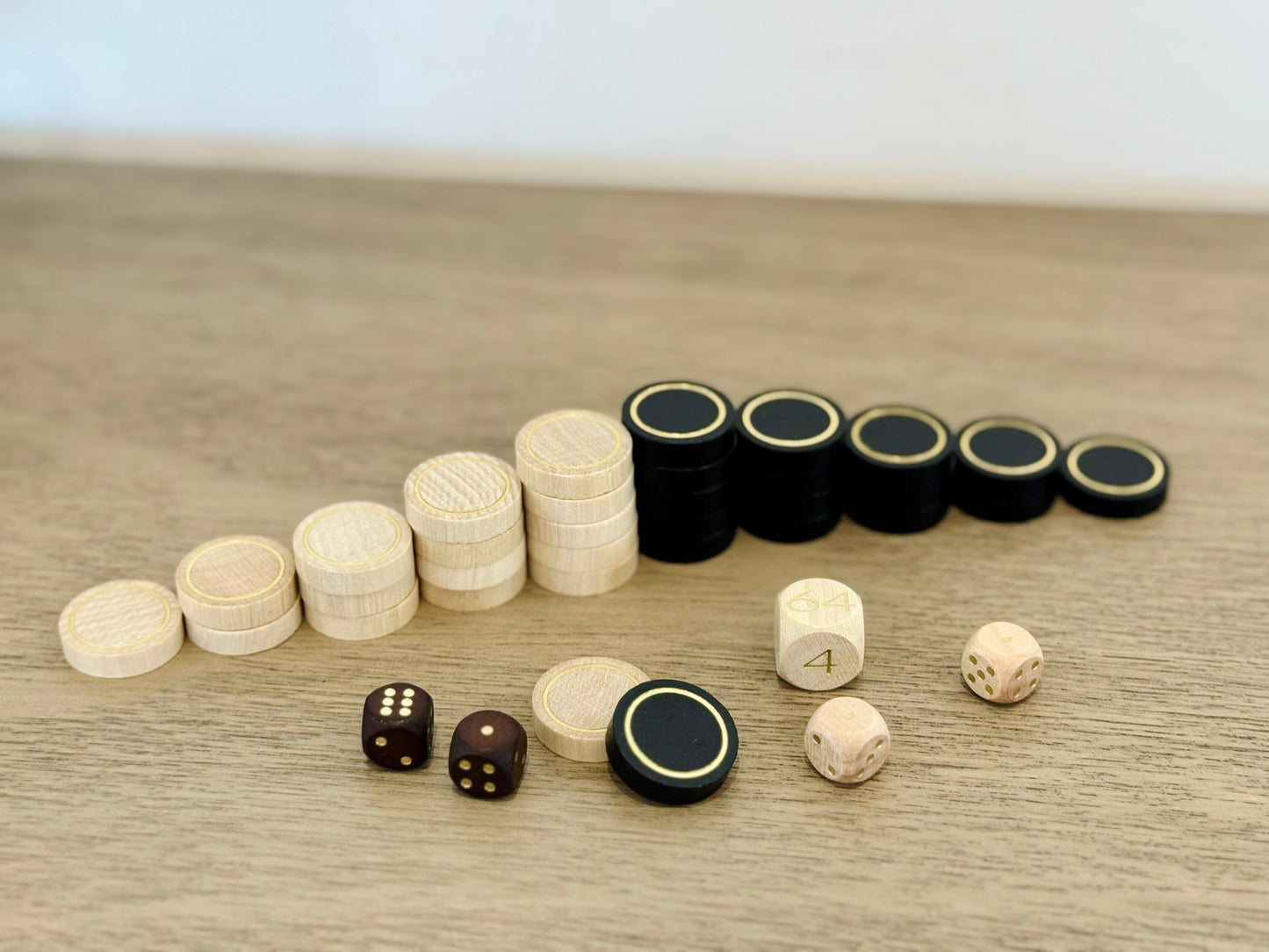 black and cream wooden backgammon checkers for the MELIA set