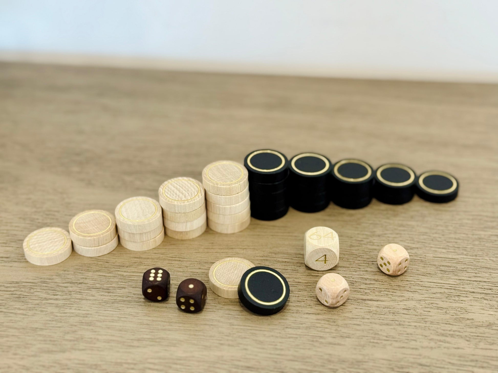 black and cream wooden backgammon checkers for the MELIA set