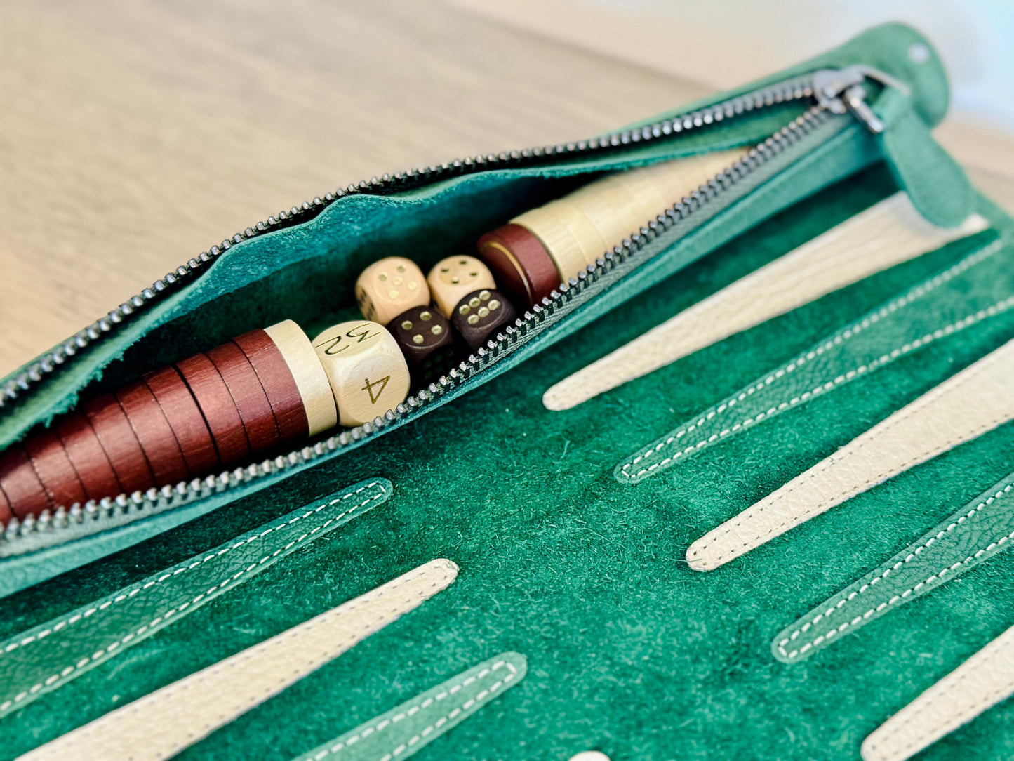 Integrated leather storage with brown and cream checkers in MELIA Celtics backgammon set