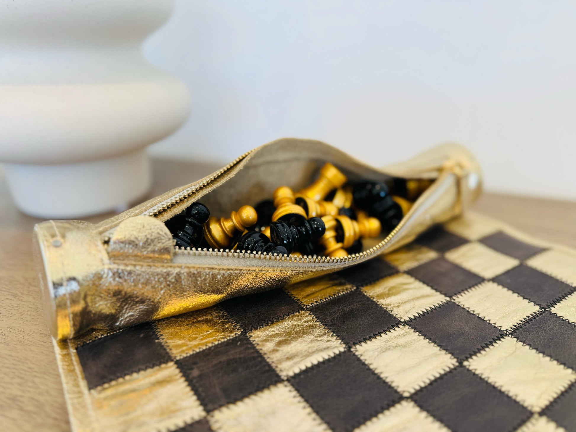 Close-up of black and gold magnetic chess pieces