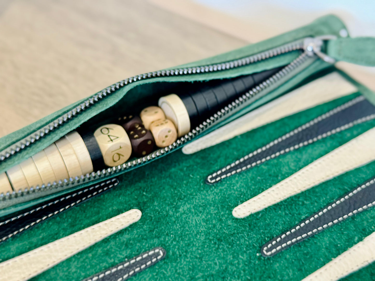 Integrated leather storage with wooden checkers inside MELIA Geneve backgammon set