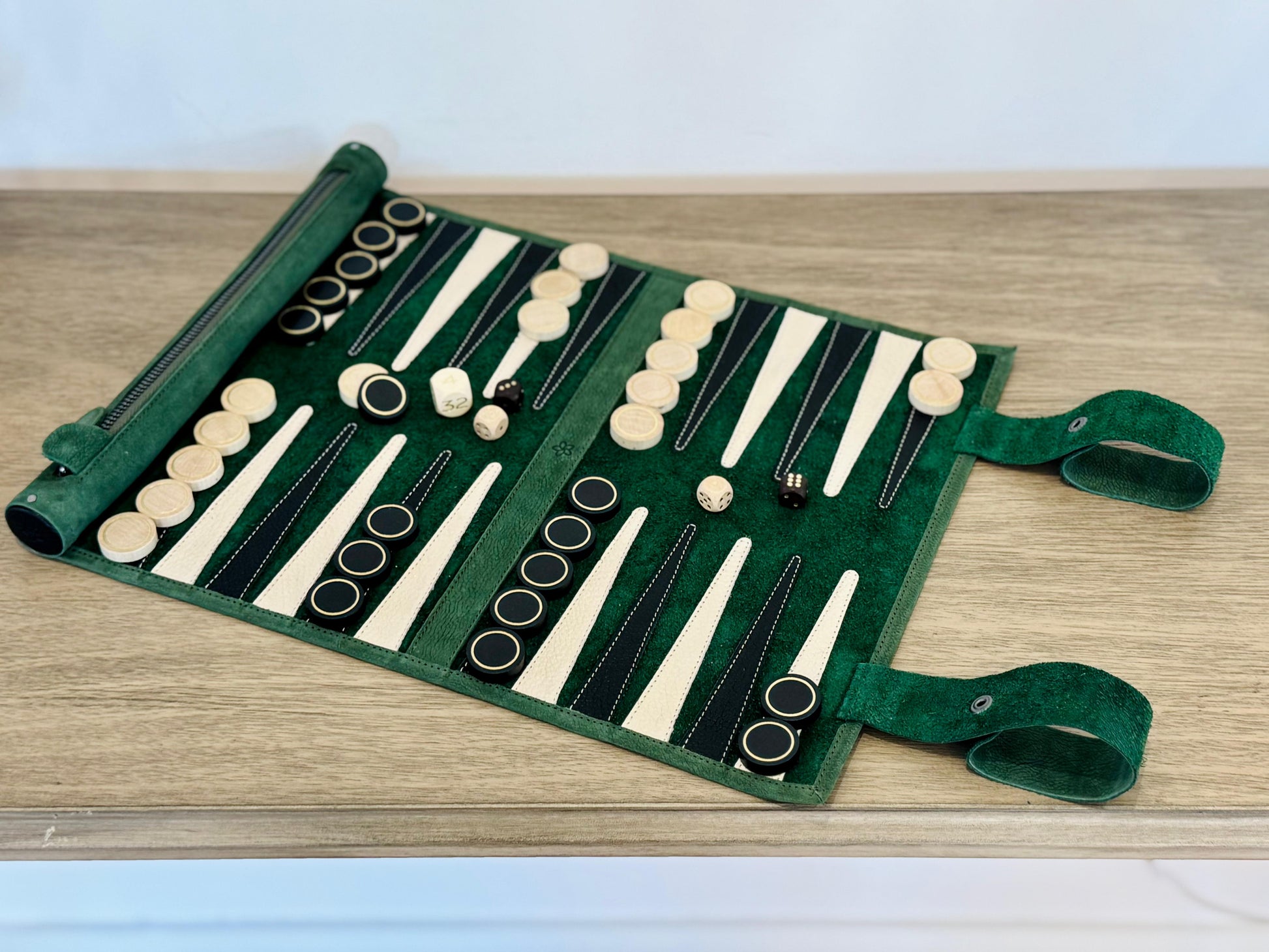 Open MELIA Geneve roll-up backgammon set handcrafted from green nubuck leather