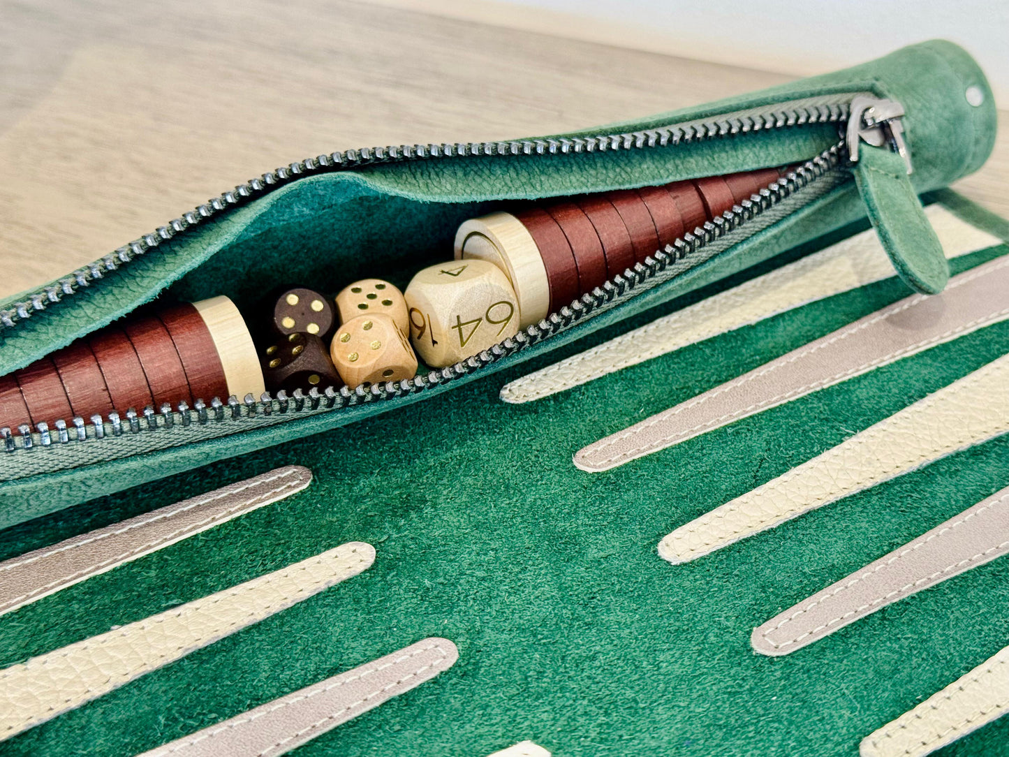 Integrated leather storage with wooden checkers inside MELIA Grande Dame backgammon set