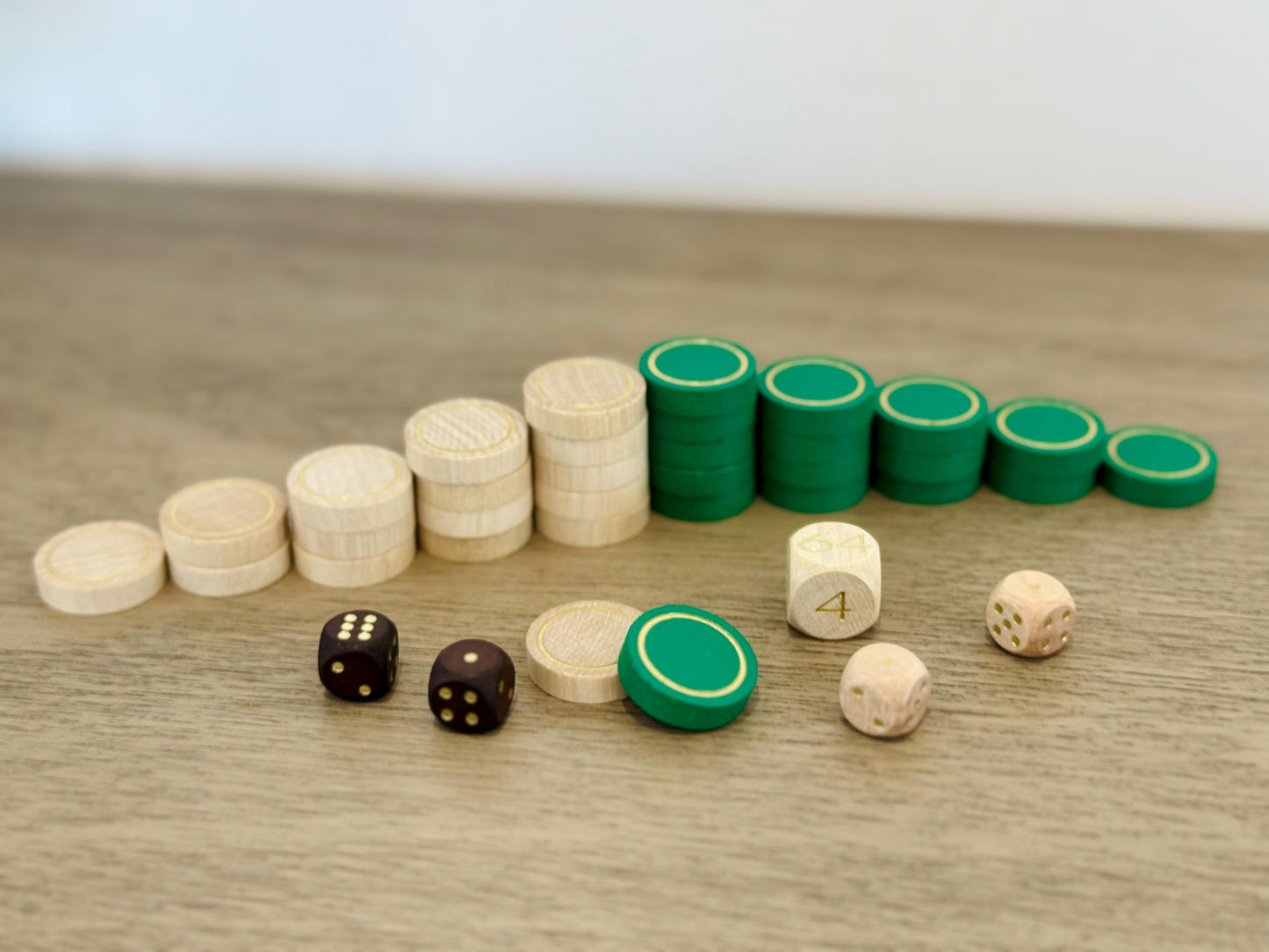 Green and cream wooden backgammon checkers with gold detailing for MELIA
