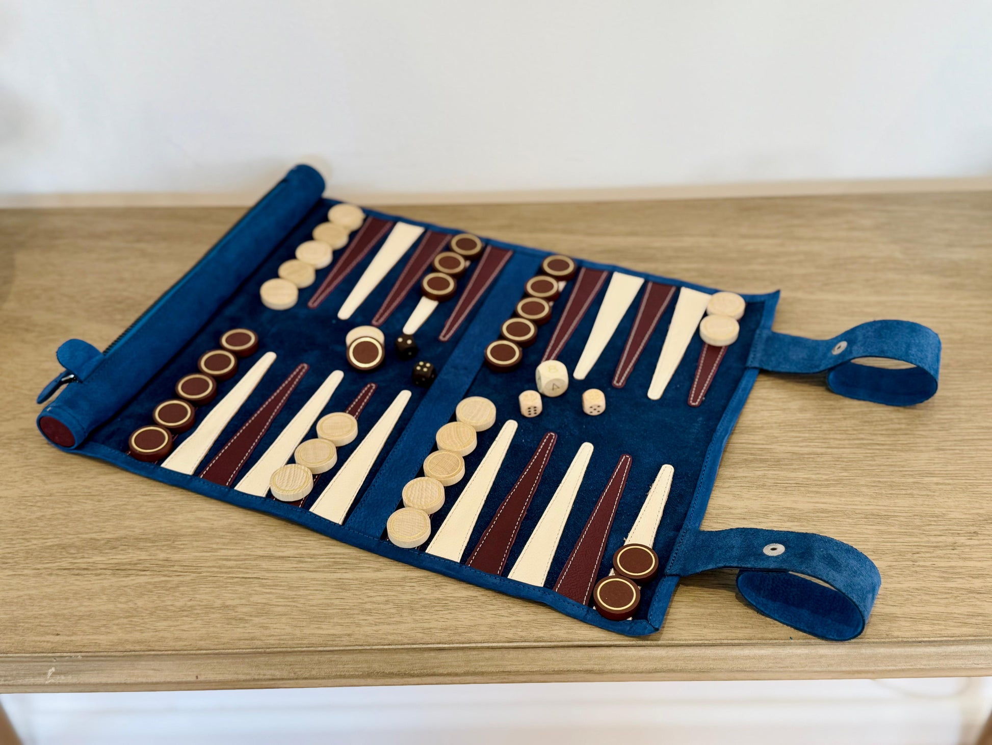 Open Les Bleus backgammon set with brown and white wooden playing pieces