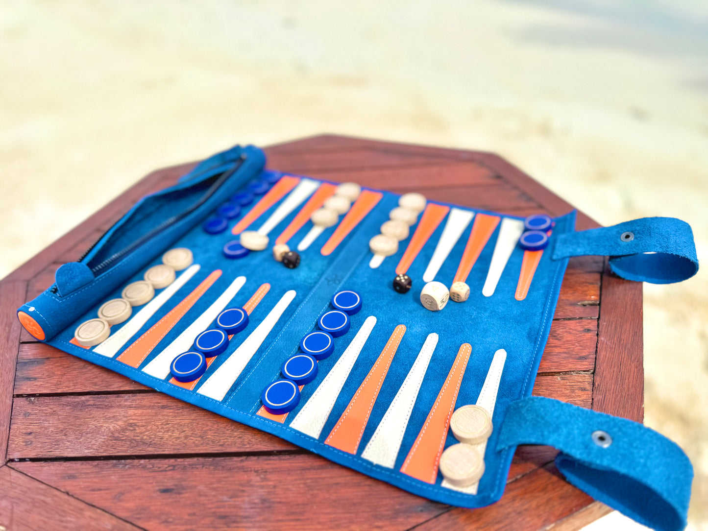 MELIA Tropicana roll-up backgammon set displayed by the beach