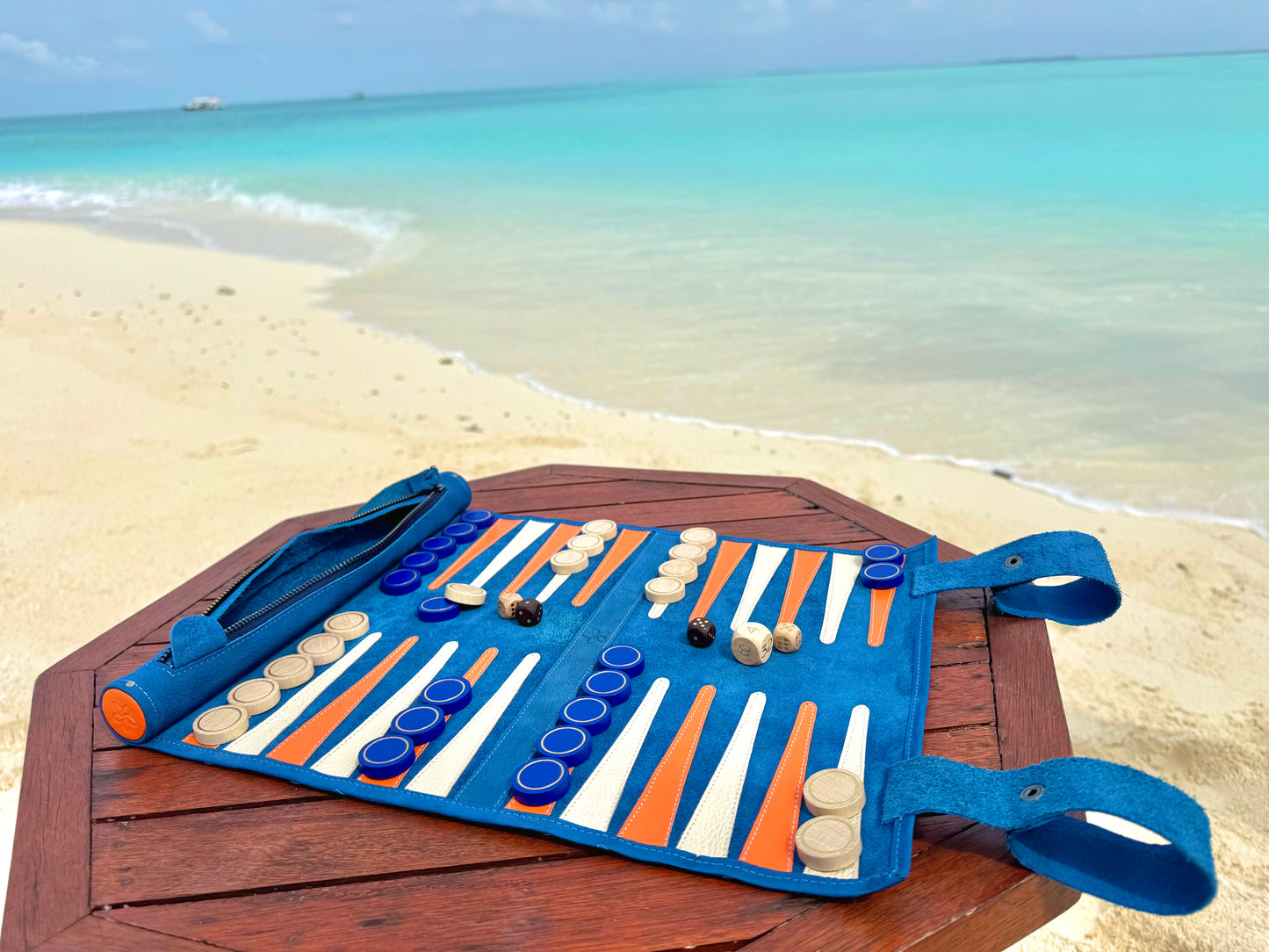 MELIA Tropicana leather backgammon set in a luxury beach travel setting