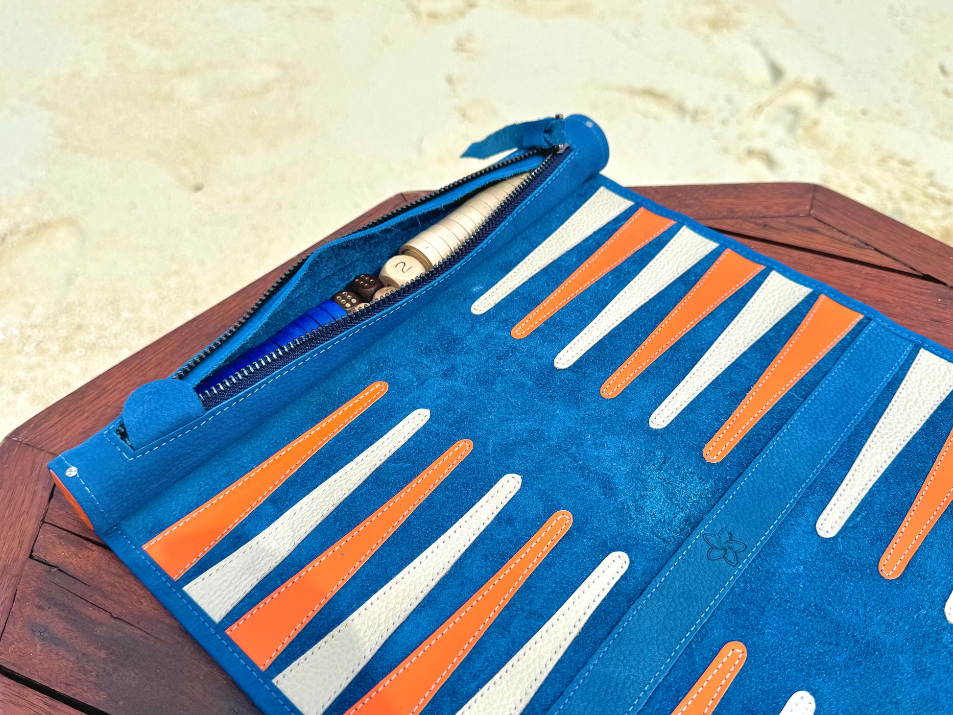 Open MELIA Tropicana backgammon board with blue orange and white leather points