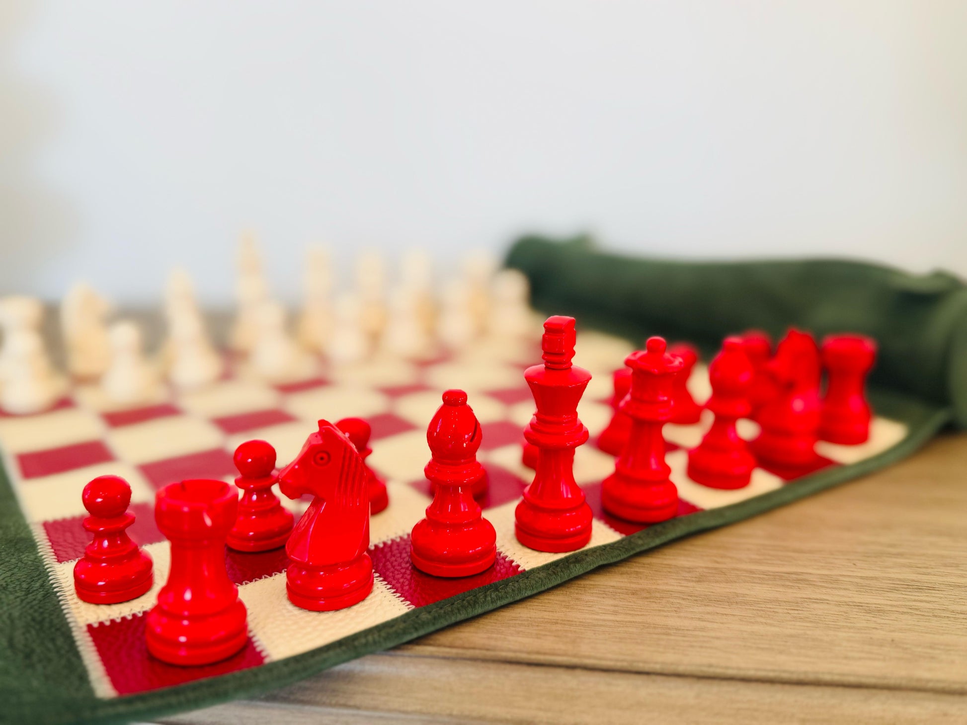 Close-up of handcrafted red magnetic chess pieces
