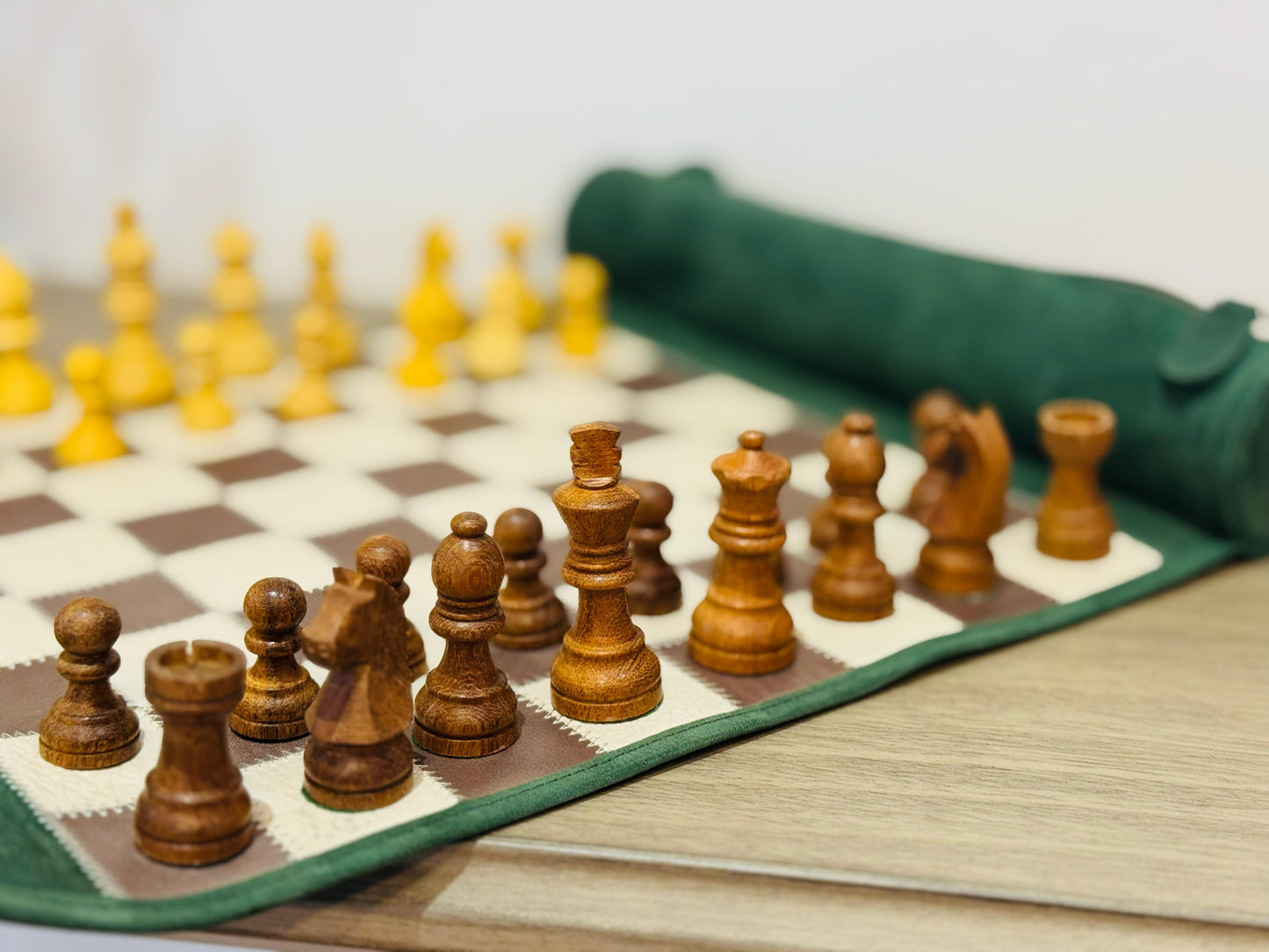 Close-up of handcrafted magnetic wooden chess pieces on the Grande Dame edition