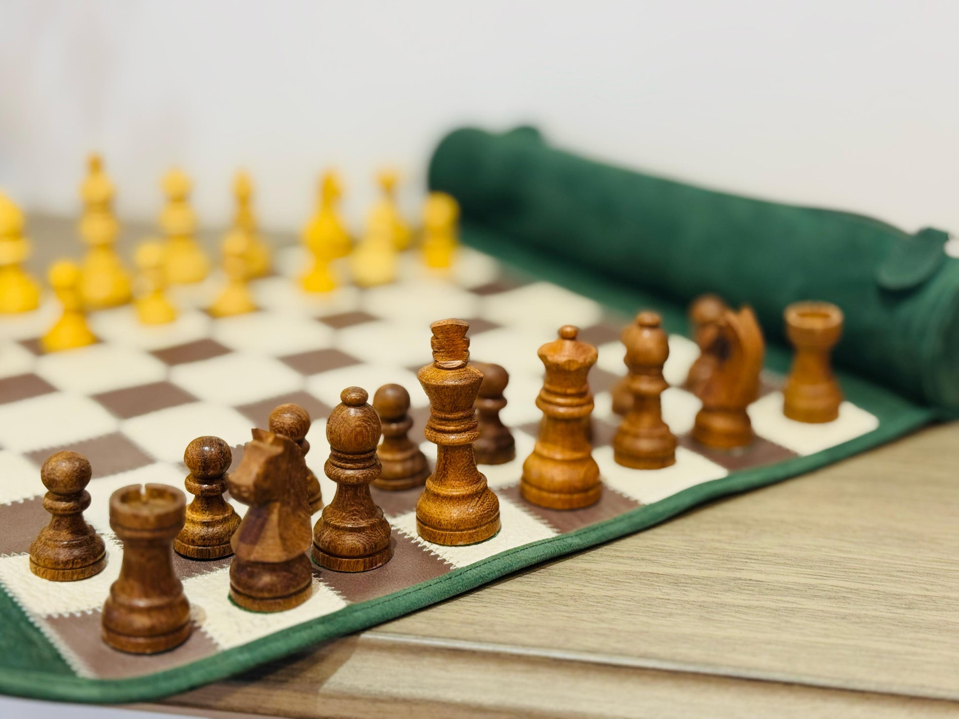 Close-up of handcrafted magnetic wooden chess pieces on the Grande Dame edition