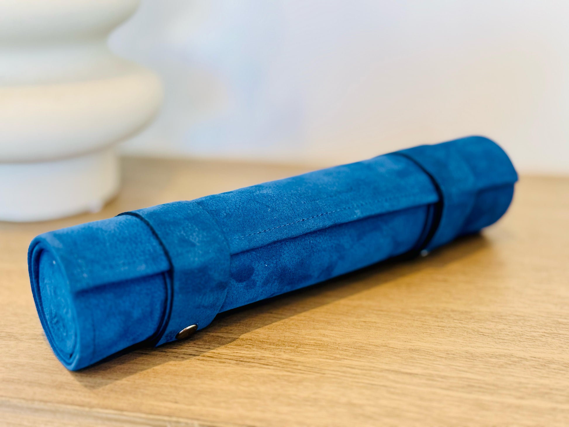 Ocean Blue chess set rolled into its compact blue nubuck leather travel case